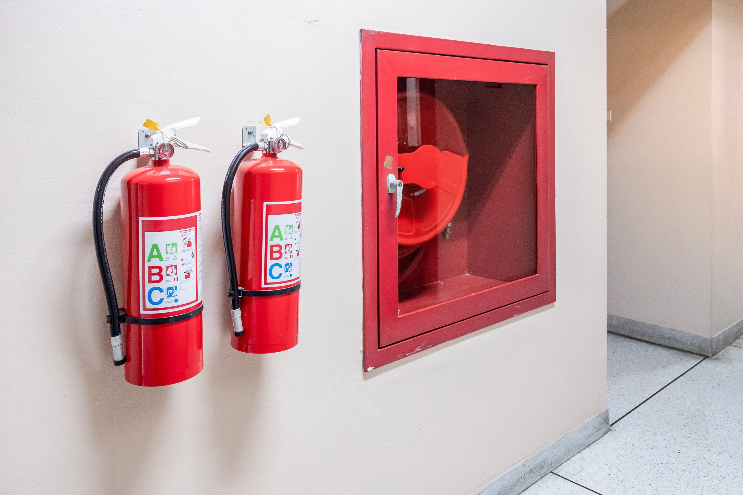 Fire extinguisher system on the wall background, powerful emerge